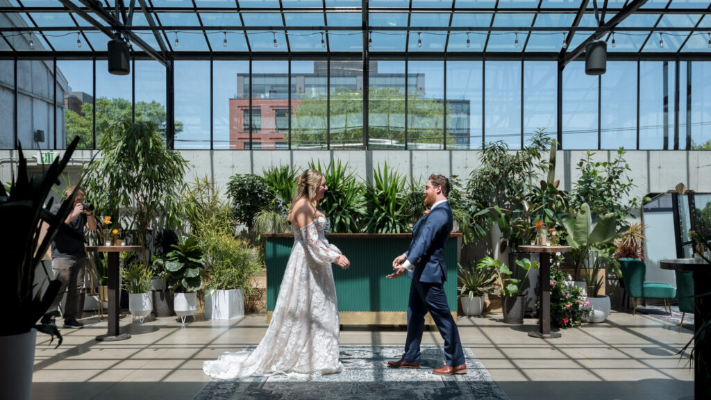 Bride and groom first look in greenhouse at The Tinsmith Madison, Wisconsin