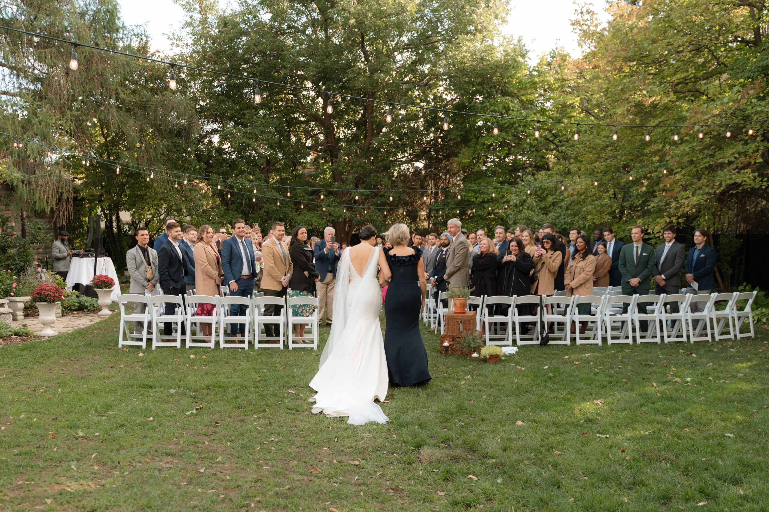Walking down the aisle at outdoor ceremony - St. Paul College Club