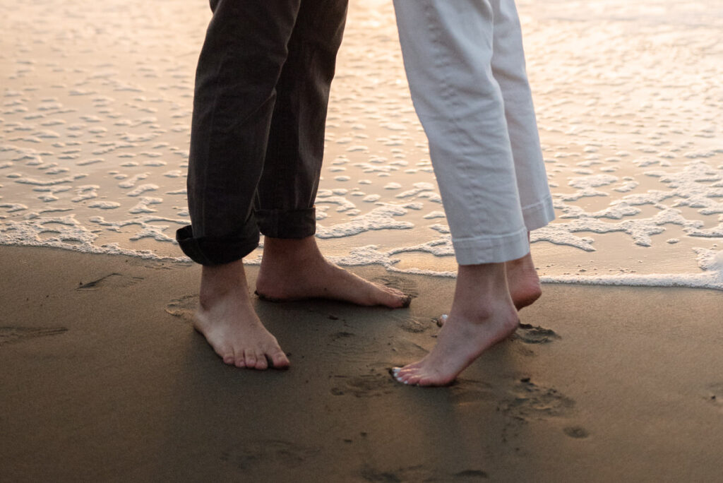 Barefoot couple on the beach